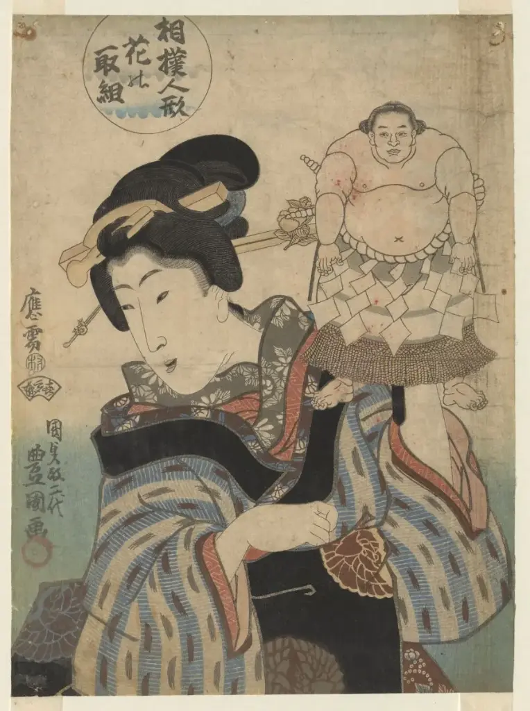 Japanse dame met handpop van sumoworstelaar Shiranue Dakuemon